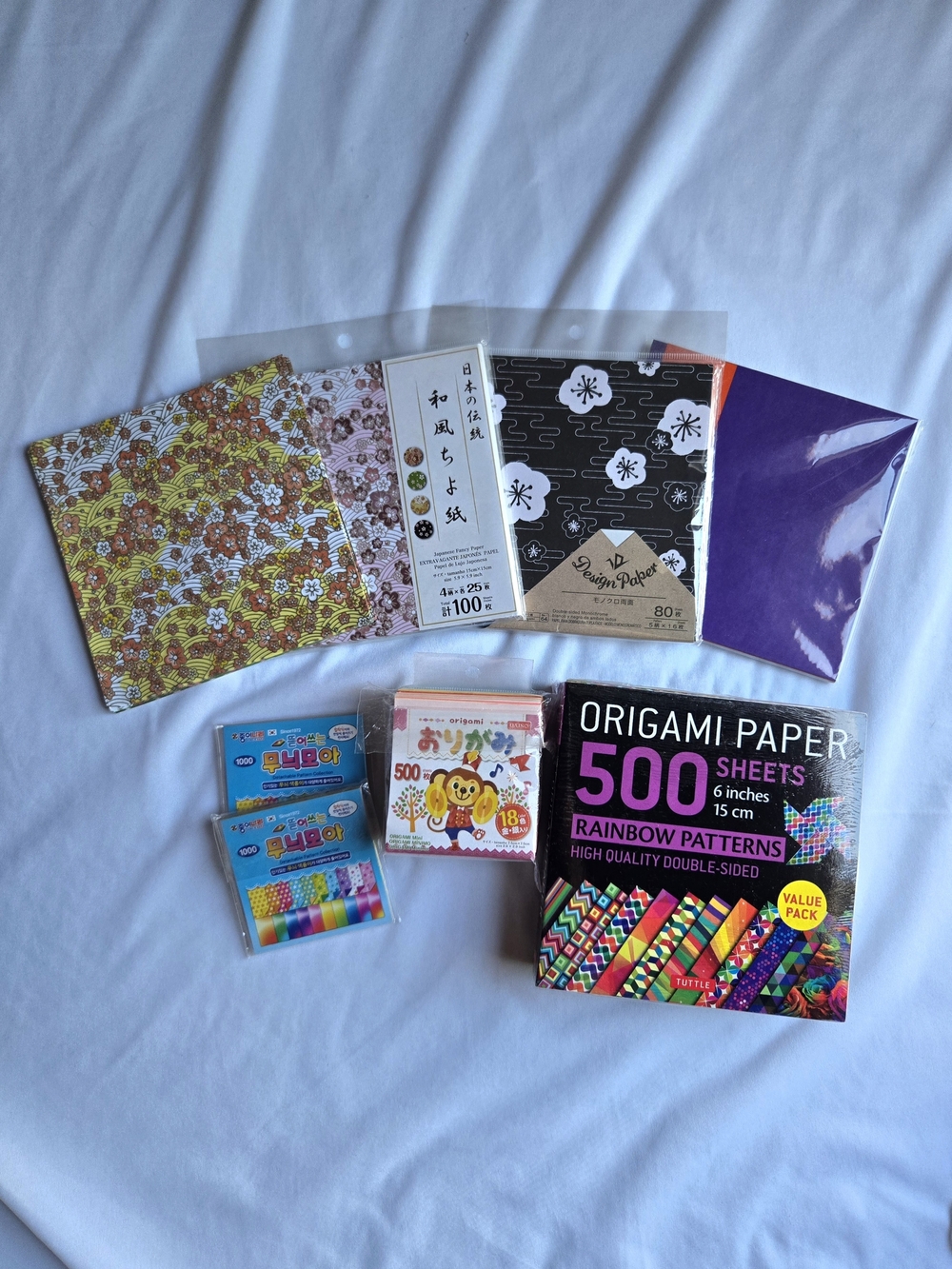 ~1500 sheets origami paper, solid + patterned 7.5 cm + 15 cm, new + lightly used